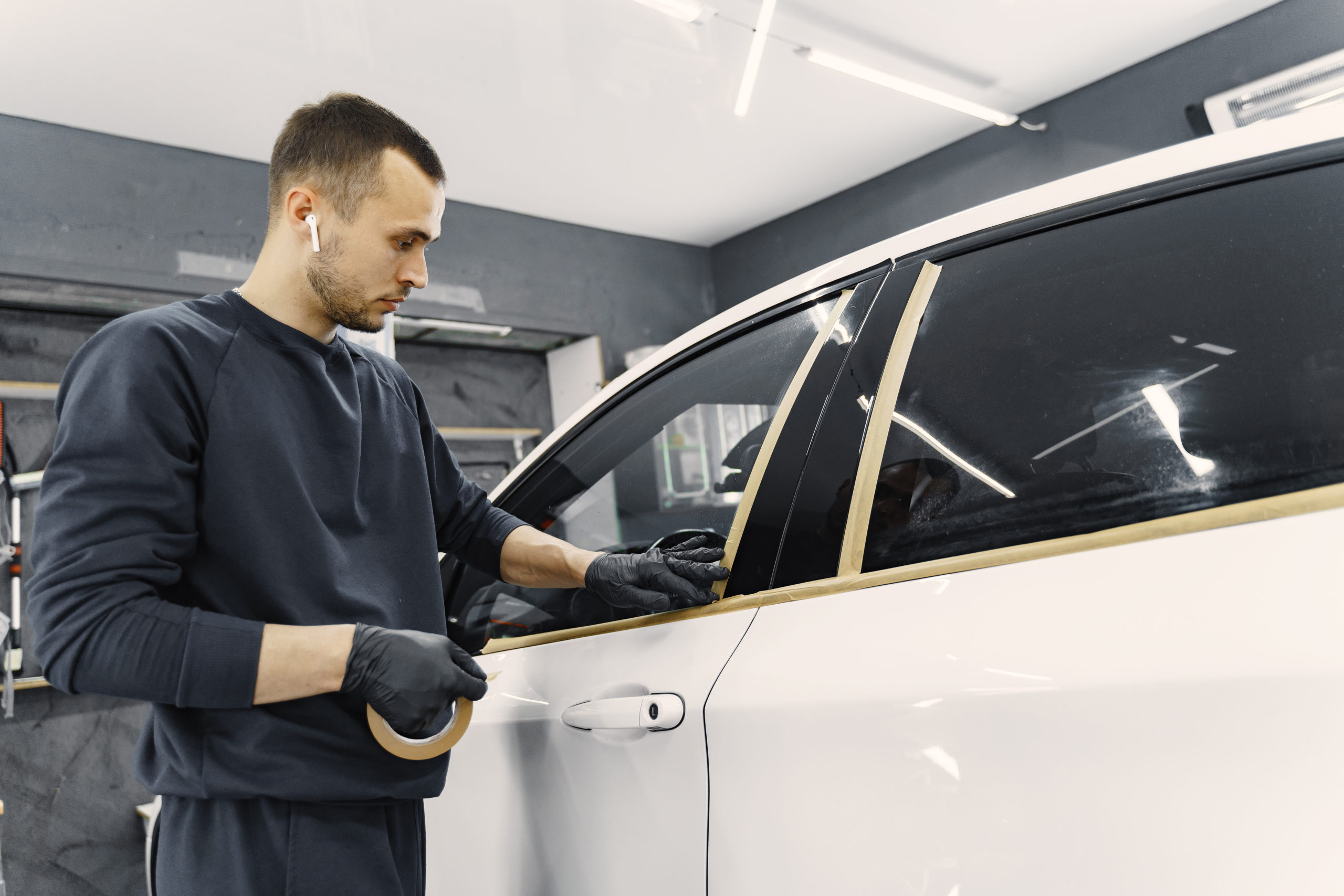 Preparing a car before spray painting